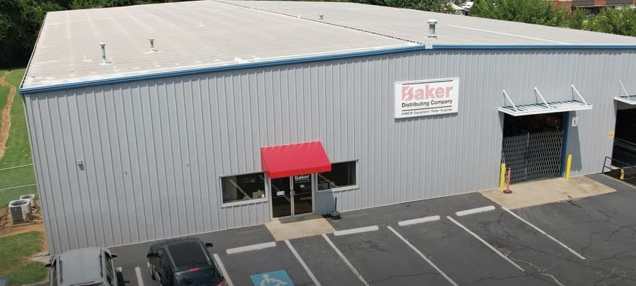 Aerial view of Baker Distributing Company industrial facility with loading docks and tenant signage at 289 Alice Street, Spartanburg, SC